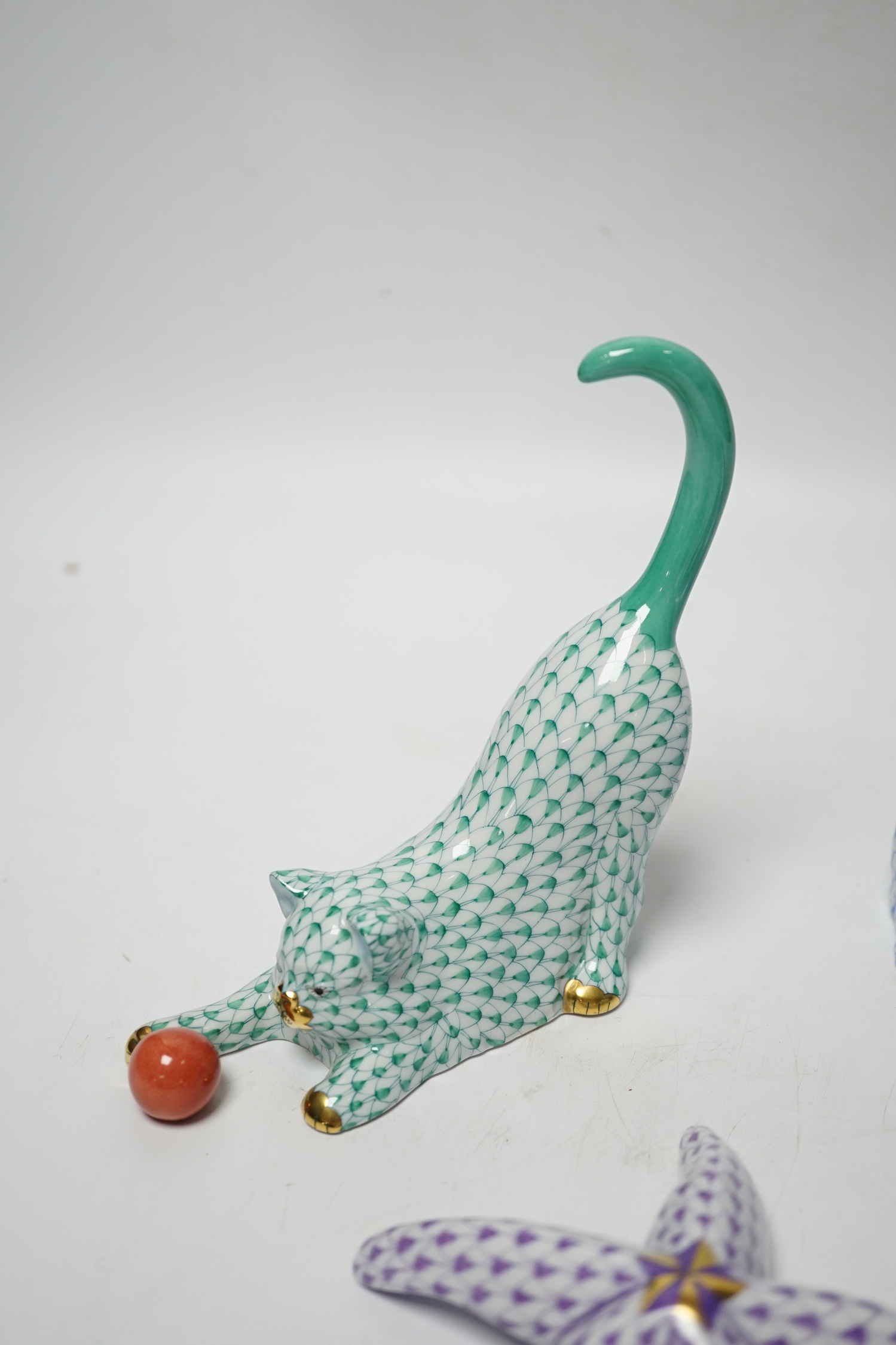 Four Herend models of a cat, badger, hippo and starfish, tallest 13cm high